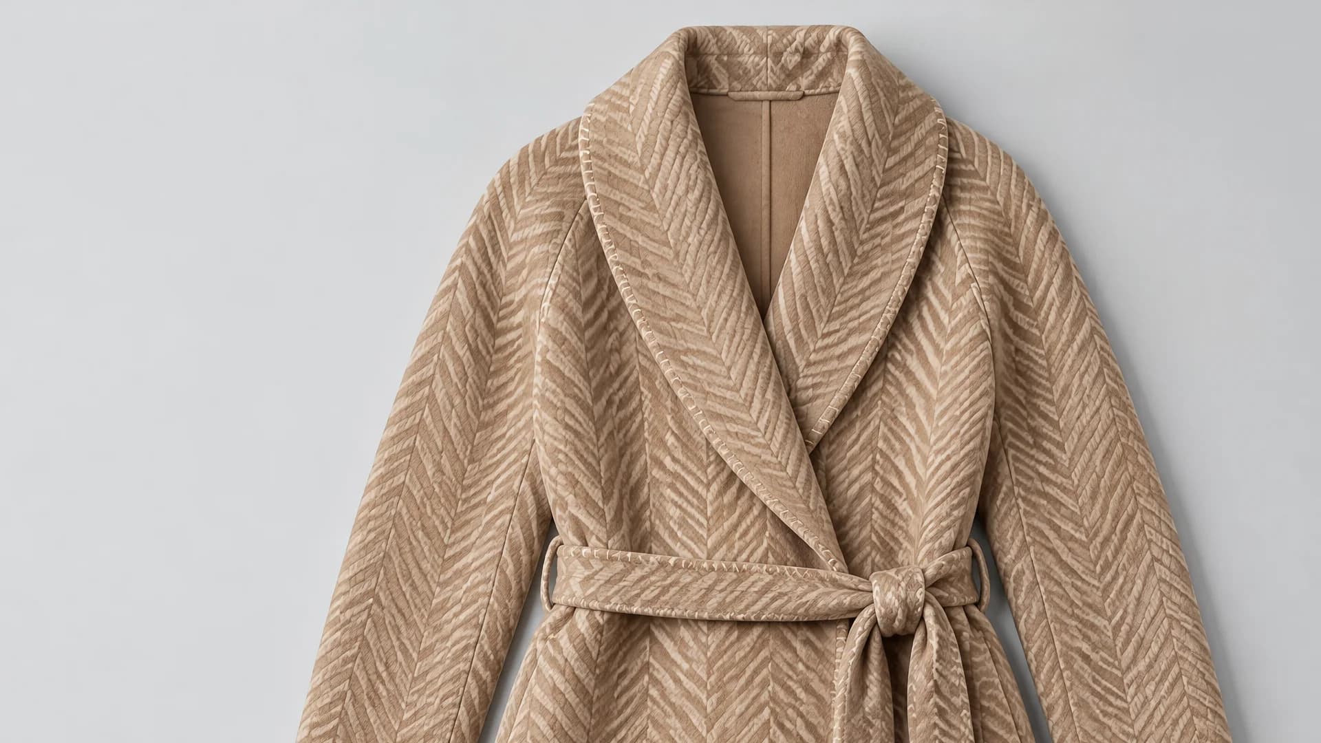 The shawl collar of the herringbone coat, up close